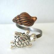silver turtle ring with a shell. wrap open ring style